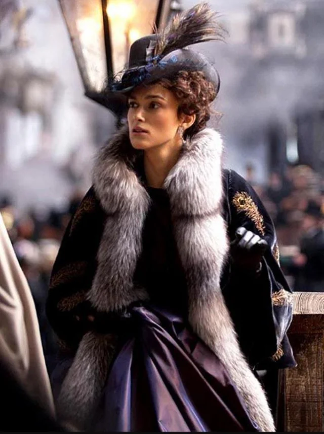 Fur-trimmed velvet coat and feathered hat